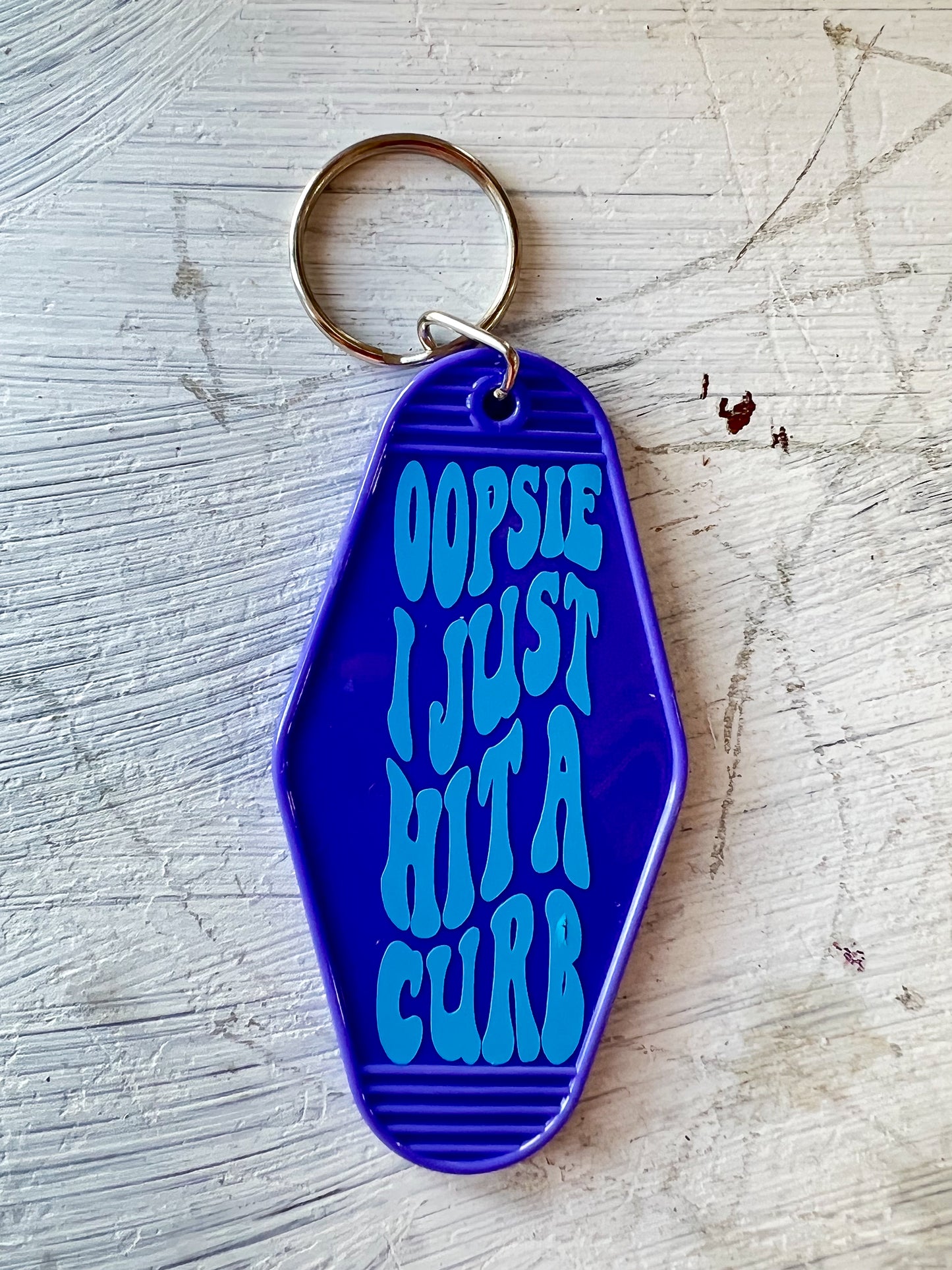 "Oopsie I Just Hit A Curb" Hotel Keychain